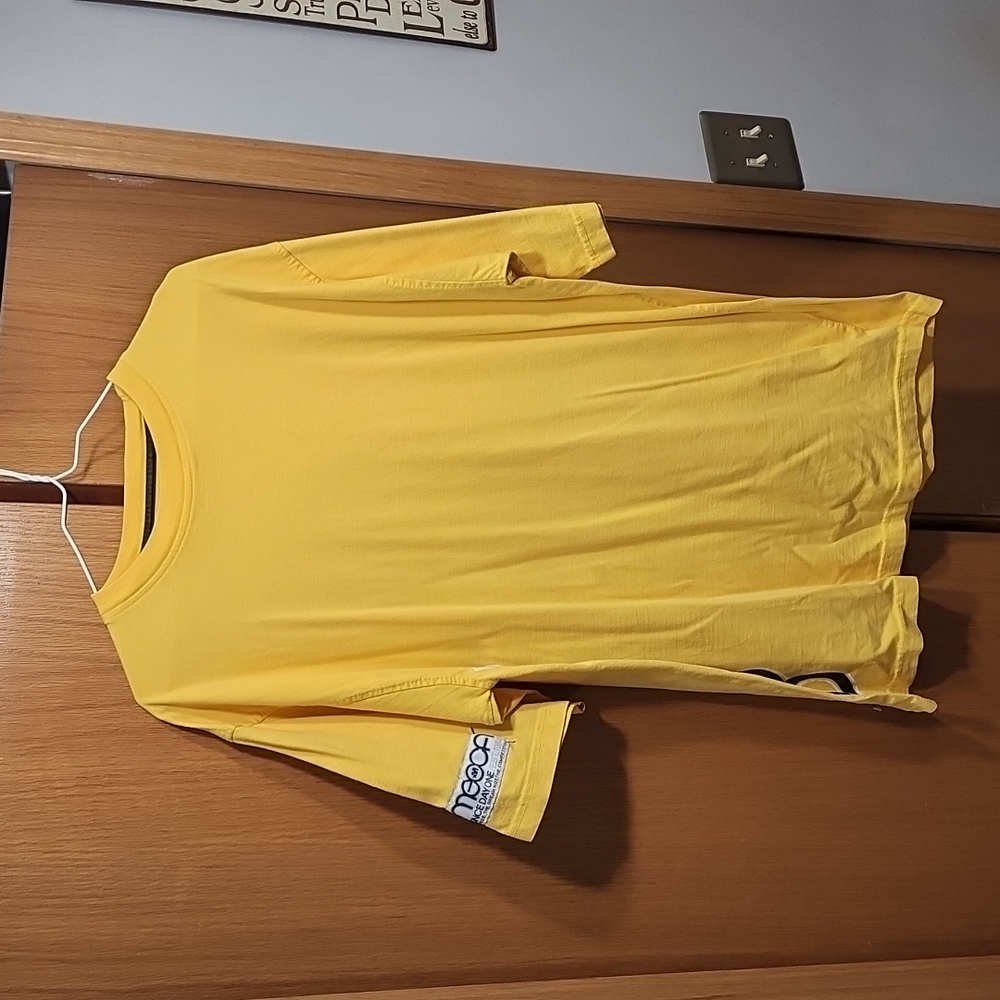 Men's Mecca brand yellow short sleeve tee shirt with Mecca logo down one side in